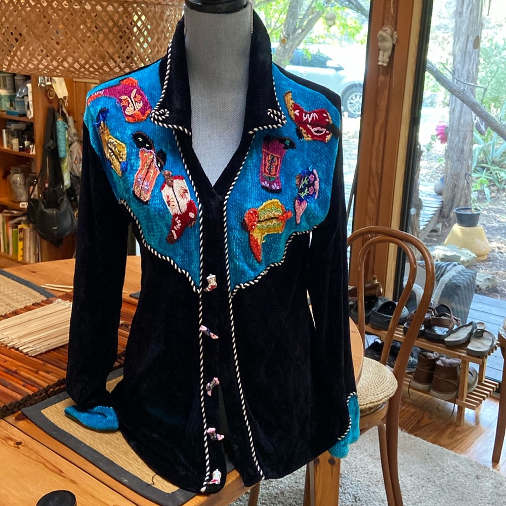 That Sweater size M. Great combo of colors, western inspired.